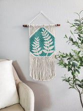 Load image into Gallery viewer, Hand painted macrame botanical wall hanging. Boho inspired home decor. Modern wall art for bedroom and living room.