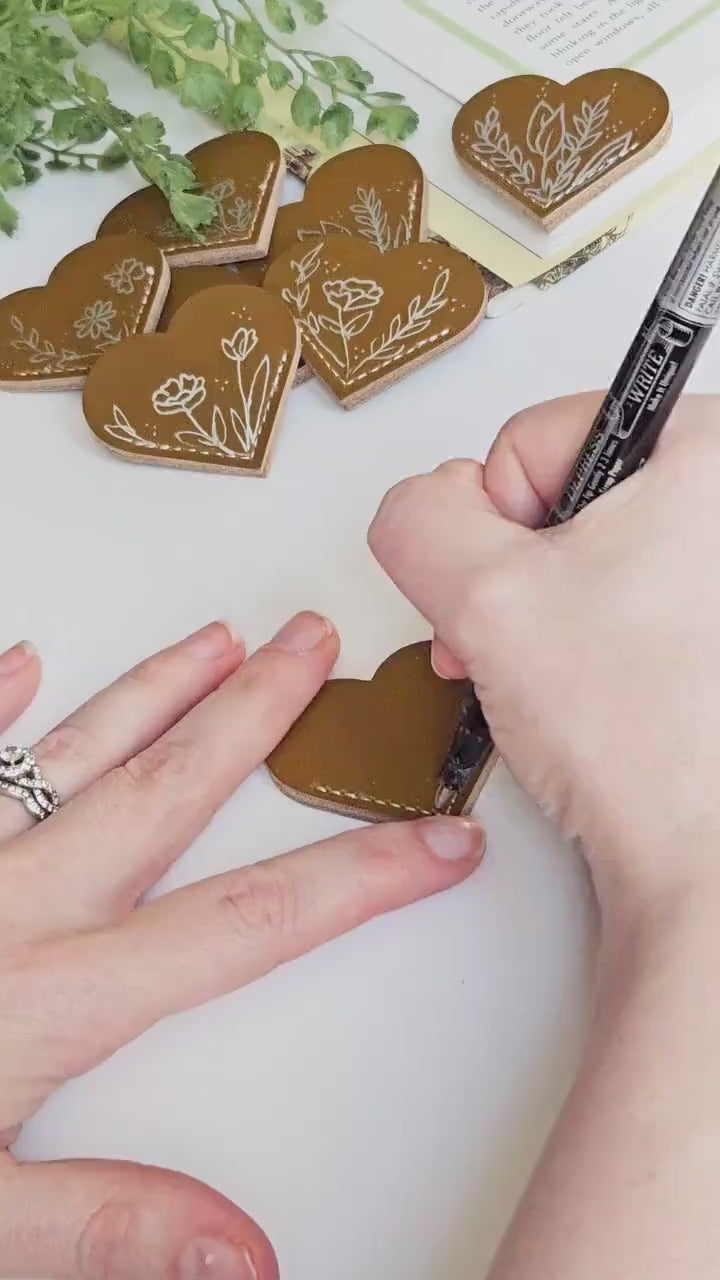 Leather Heart Bookmarks with Exquisite Hand-Drawn Metallic Botanical Designs for book lovers.