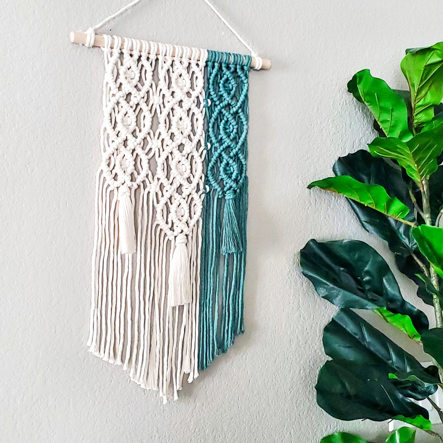 Green and natural geometric macrame wall hanging