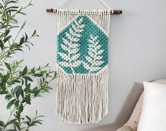 Hand painted macrame botanical wall hanging. Boho inspired home decor. Modern wall art for bedroom and living room.