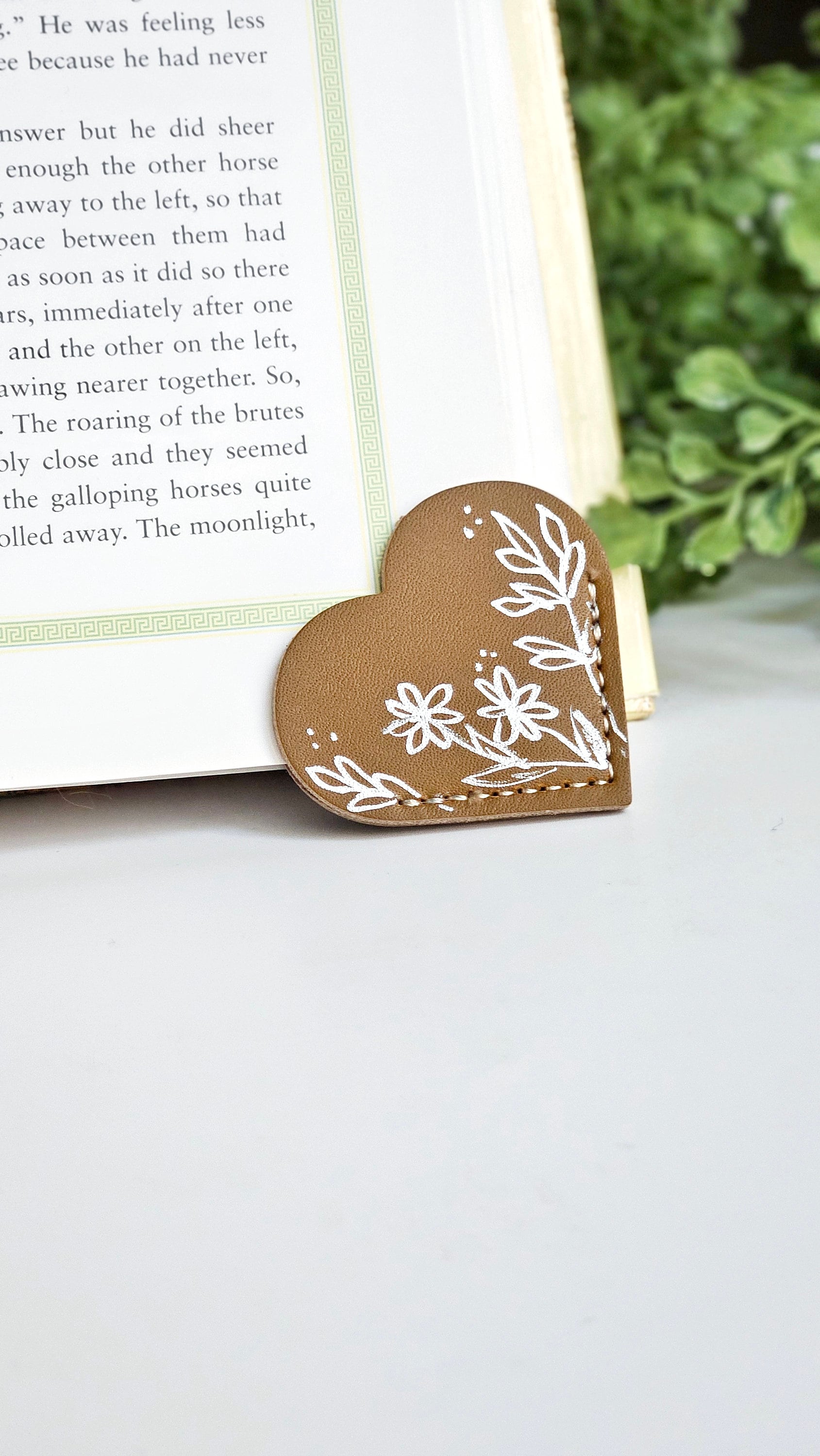 Leather Heart Bookmarks with Exquisite Hand-Drawn Metallic Botanical Designs for book lovers.